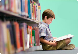 Student reading independently in classroom library