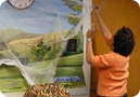 Teacher decorating her classroom to promote student involvement
