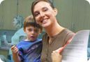 An informed parent smiles after a successful parent-teacher conference