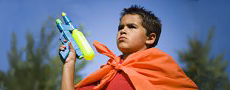 little boy with a water gun