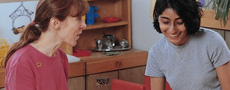 Preschool director and teacher in a meeting 