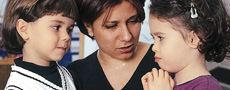 A teacher setting limits for two children