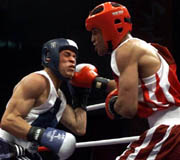 <p>Algeria's Hichem Blida, right, lands a right to Puerto Rico's Orlando Ivan Cruz Torres during the 54kg qualifying bout at the 2000 Summer Olympic Games. (AP/Wide World)</p>