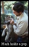 Mark holds a pup