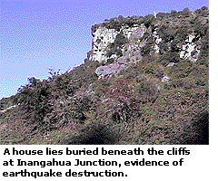 A house lies buried beneath the cliffs at Inangahua Junction, evidence of earthquake destruction.