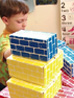 Children develop physical skills by building blocks
